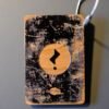 Issue 3’s limited special edition Falling Man wooden bag tag