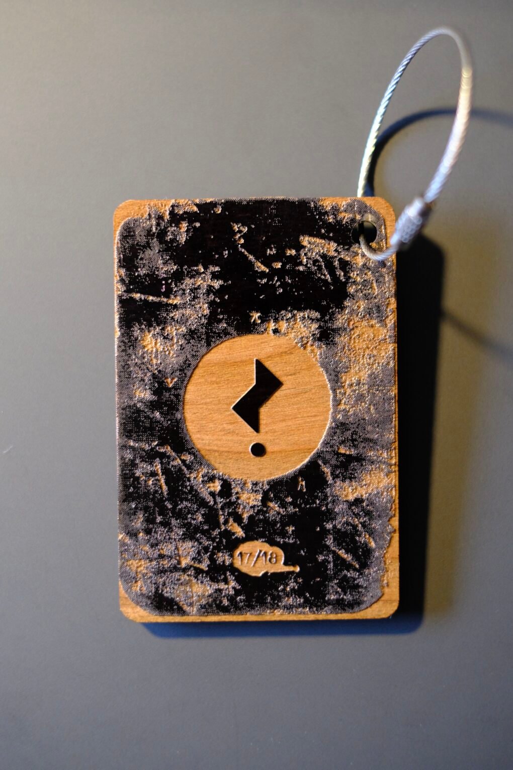 Issue 3’s limited special edition Falling Man wooden bag tag