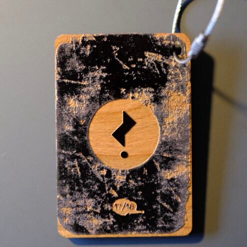 Issue 3’s limited special edition Falling Man wooden bag tag
